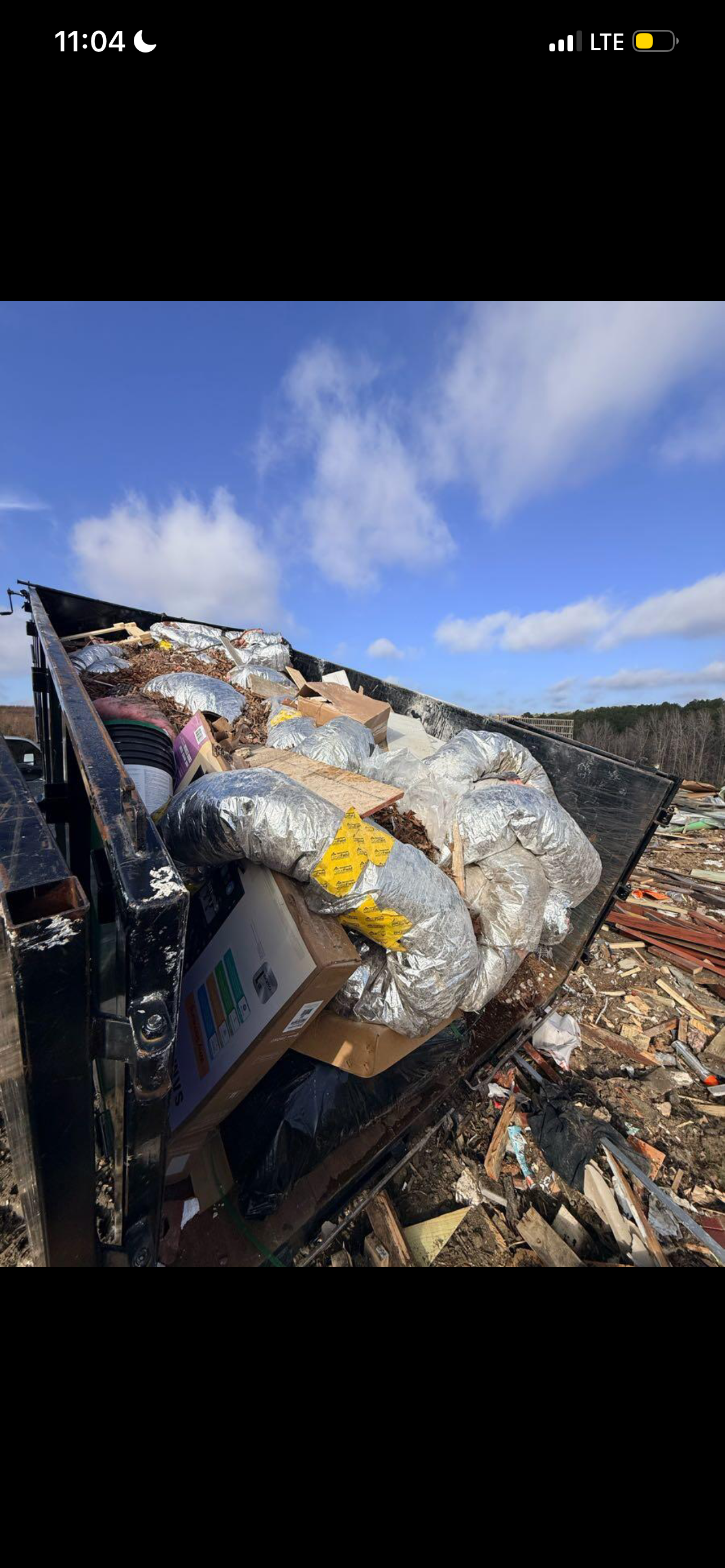 Iron Junk Removal trailer loaded with items